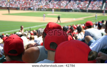 A large crowd watching a baseball game.