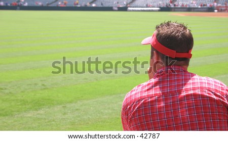 A man watching a baseball game.