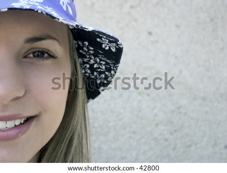 A young woman wearing a purple hat.
