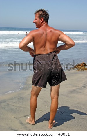 A man goofing around at the beach.