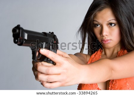 Asian Woman Pointing Gun