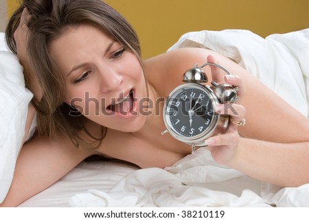 Girl Waking Up to Alarm Clock