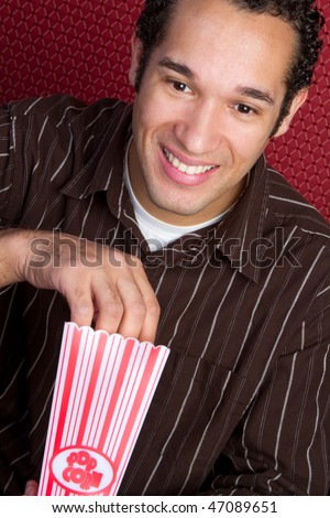 stock-photo-man-eating-popcorn-47089651.jpg