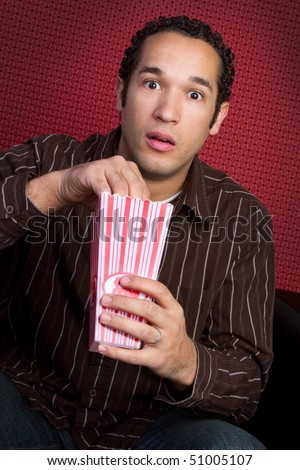 stock-photo-man-eating-popcorn-51005107.jpg