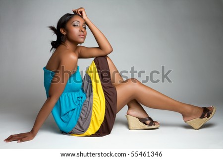Beautiful black fashion woman sitting