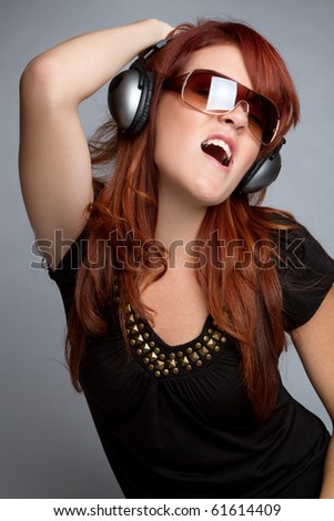 stock photo Beautiful redhead headphones music woman