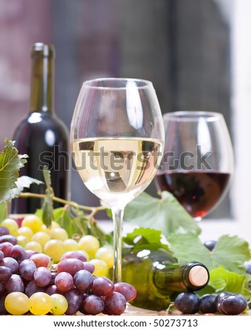 Wine glass with  bottle of wine