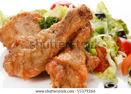 Roasted chicken legs with salad