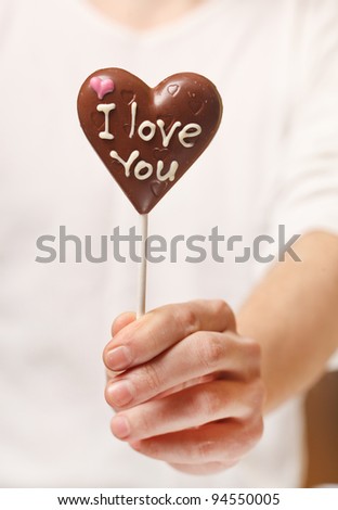 man with chocolate heart in the hands