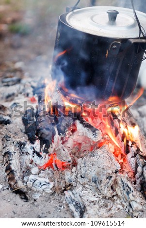 Preparing food on campfire