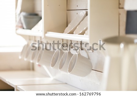Opened Cupboard With Kitchenware Inside