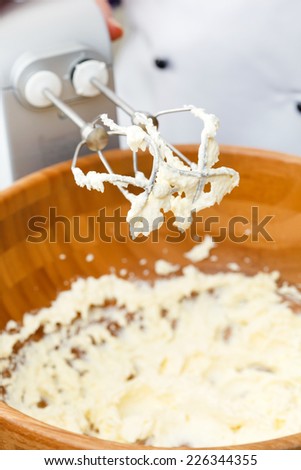 electric mixer with a dough with beaten