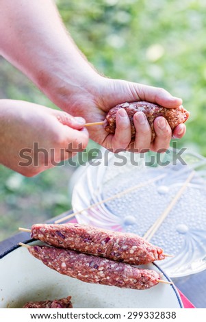 chef making kebabs