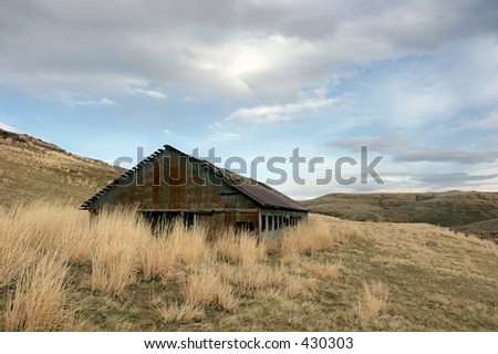 an old, abandoned, and rusting building in rural montana. building was part of a coal mine back in the 40\'s.