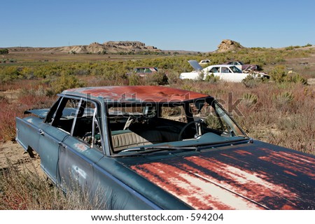 stock photo abandoned cars littering the landscape in rural wyoming