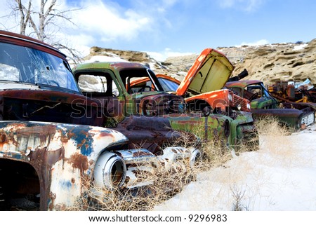 stock photo old classic and vintage cars in the snow at a junkyard in 