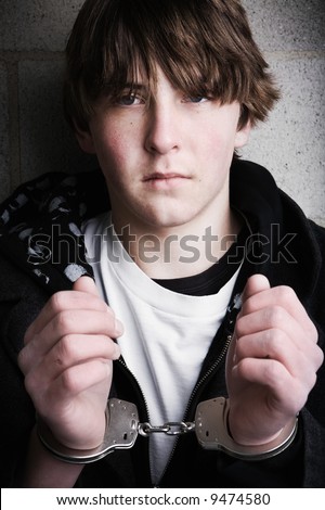 stock photo handcuffed teen portrait close up