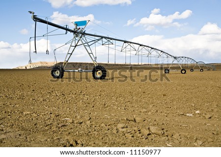 irrigation system - automated agricultural sprinkler system, ready and waiting for the season