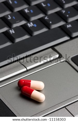 online pharmacy - generic prescription medicine on a laptop touch pad