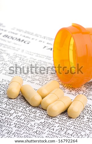prescription antibiotics medication with instructions / care sheet on white, limited depth of field