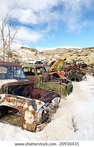 stock photo abandoned vintage classic cars in junkyard during winter