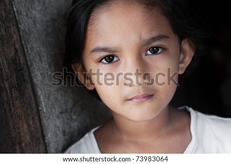 Portrait of a Filipina - young girl from the Philippines against grunge background in natural light