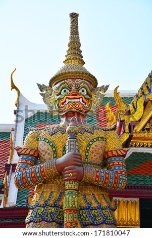 BANGKOK - JAN 9 2014 : The Red Demon, guardian who protects Wat Phra Kaew, Temple of Emerald Buddha in Grand Palace, the iconic landmark in Bangkok, Thailand