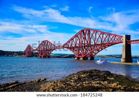 EDINBURGH, SCOTLAND - 18 JULY 2013: The Forth Bridge, a cantilever railway bridge over the Firth of Forth in the east of Scotland, 9 miles (14 kilometres) west of central Edinburgh.