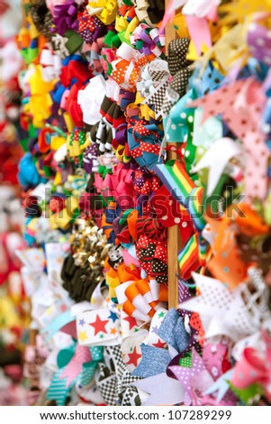Brightly Colored Ribbons Fill Wall Of Vendor Booth At Festival