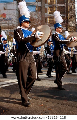 ATLANTA, GA - DECEMBER 1:  Cymbal players from the Georgia State University band march in the annual Atlanta Christmas parade on December 1, 2012 in Atlanta, GA.