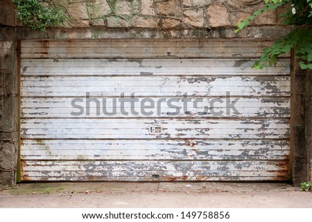 Old garage door with rust and chipped paint