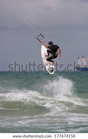 FT. LAUDERDALE, FL - DECEMBER 28:  A man catches big air while parasail surfing off the coast of Florida over the Christmas holidays, on December 28, 2013 in Ft. Lauderdale, FL.
