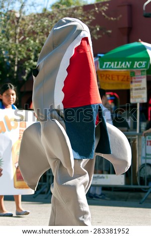 MIAMI, FL - DECEMBER 28:  A person walks wearing a shark costume in the annual Mango Strut parade in Coconut Grove on December 28, 2014 in Miami, FL.