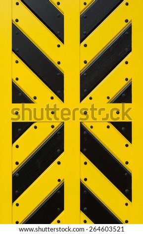 Reinforced door to the fortress, painted yellow and black