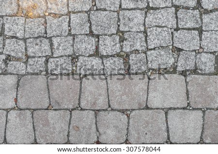 Street paved with granite stones and concrete