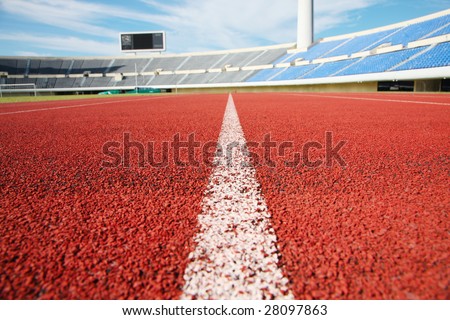 a close up photo of a sports stadium running track