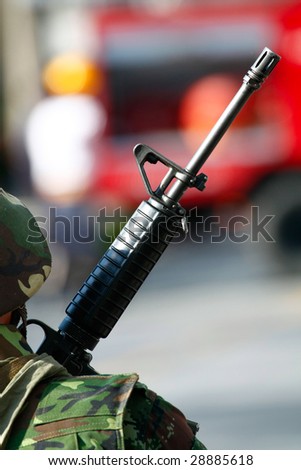 a photo of a soldier holding a machine gun