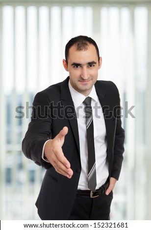 Businessman giving hand for handshake