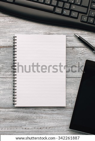 Top view of an opened notebook on a wooden desk. Business concept.Copy space.
