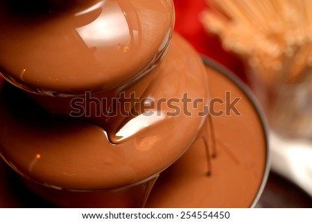 Chocolate fountain placed on a table in wedding day