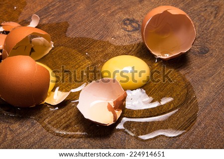 break eggs on the wooden floor
