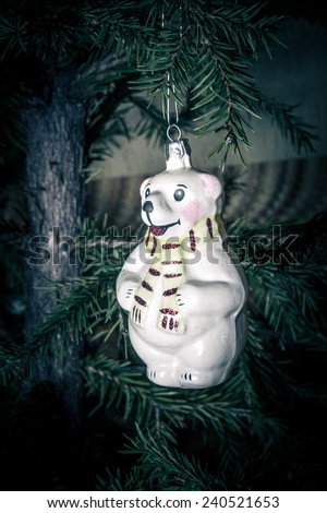 Christmas Toy Polar Bear with scarf hanging on the Christmas tree
