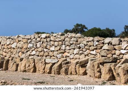 fence built of natural stone.