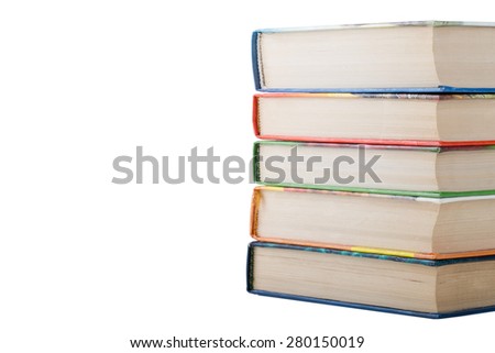 A stack of books in color covers isolated on white background. Space for text.