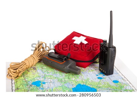 Map, gps navigator, portable radio, rope and first aid kit on a light background. Set lifeguard. Toned.