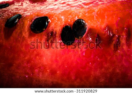 Sweet juicy watermelon with black seeds. background. Shallow depth of field. Tinted