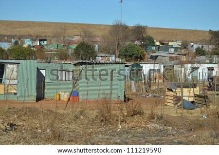 Houses or shacks in a cluster in a poverty stricken area made out of steel,bricks,windows an informal settlement in Africa