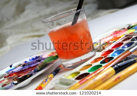 Art palette, watercolors, brushes and water