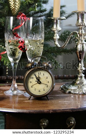 New Year celebration with champagne and old clock