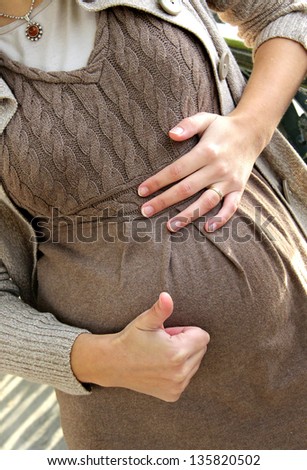 Beautiful pregnant woman tummy, detail